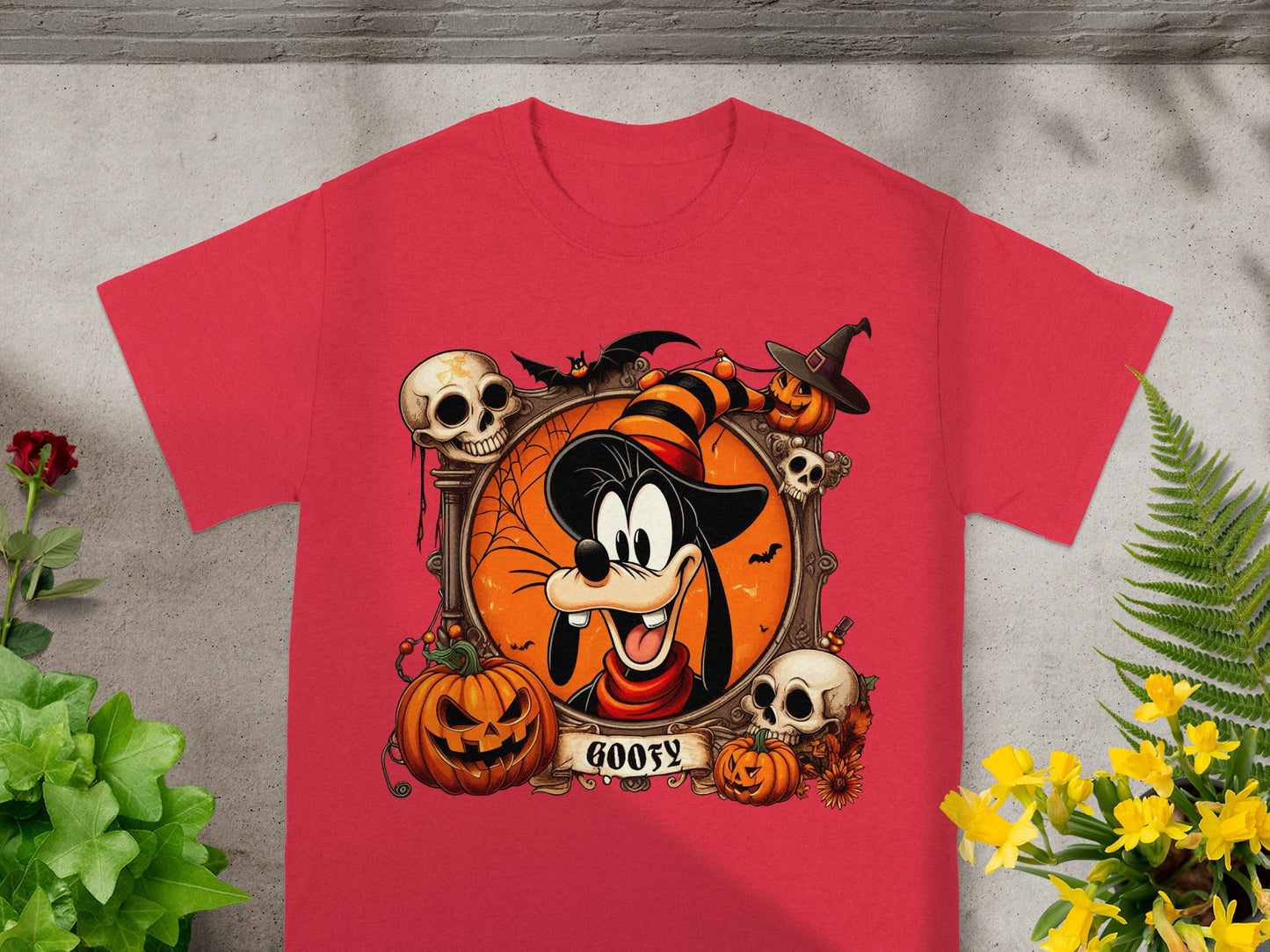 Halloween Goofy graphic on a red t-shirt with pumpkins, skulls, and bats.