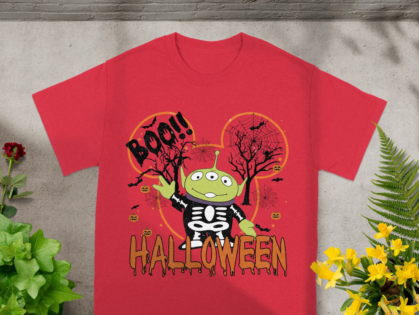 Red t-shirt with alien in skeleton costume and "Boo!!" and "Halloween" text.