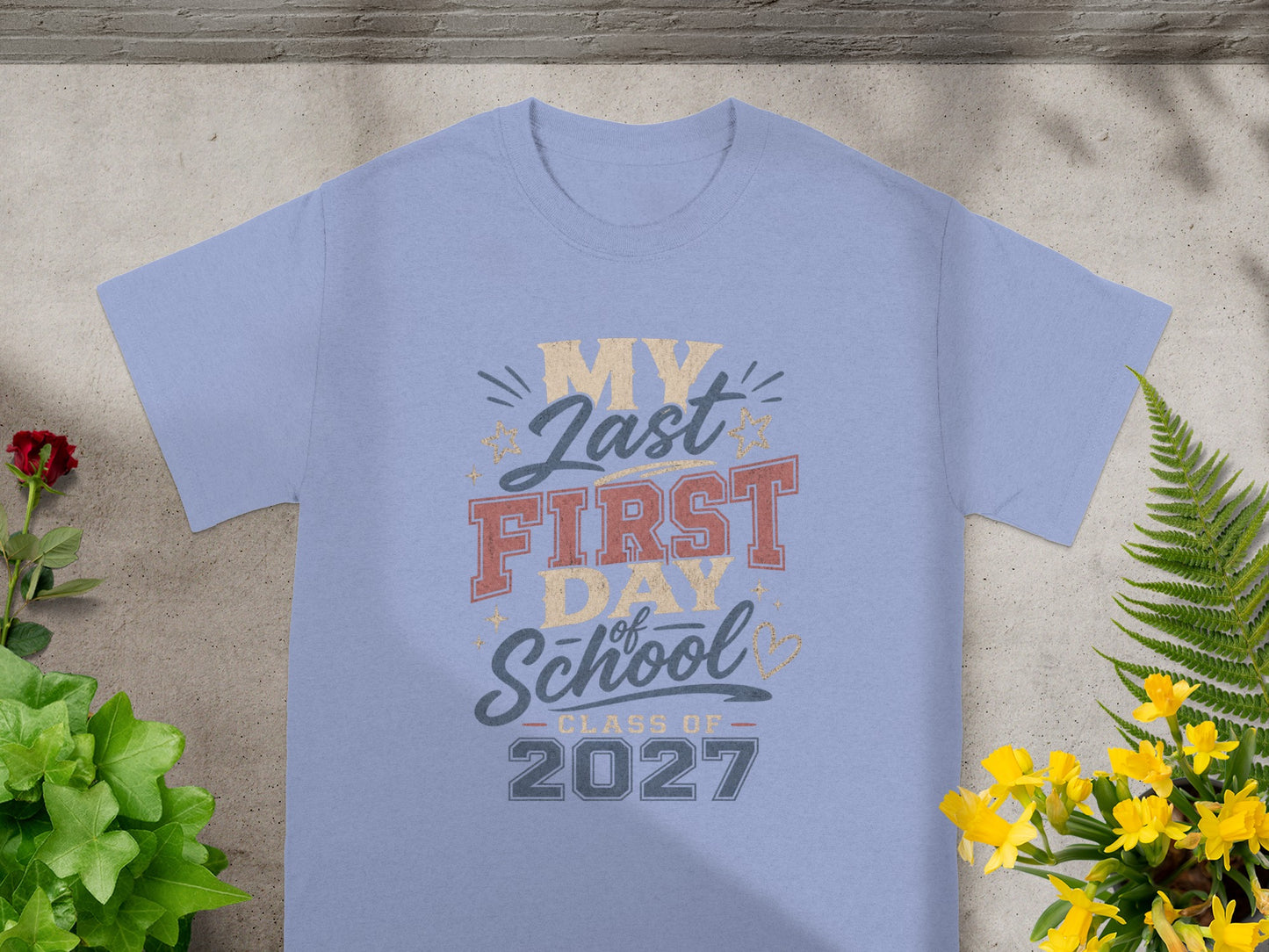 Light blue t-shirt with "My Last First Day of School Class of 2027" graphic.