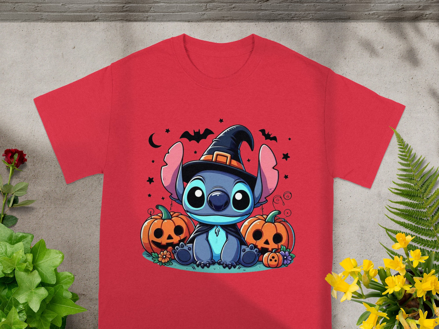 Red t-shirt featuring Stitch in a witch hat with pumpkins.