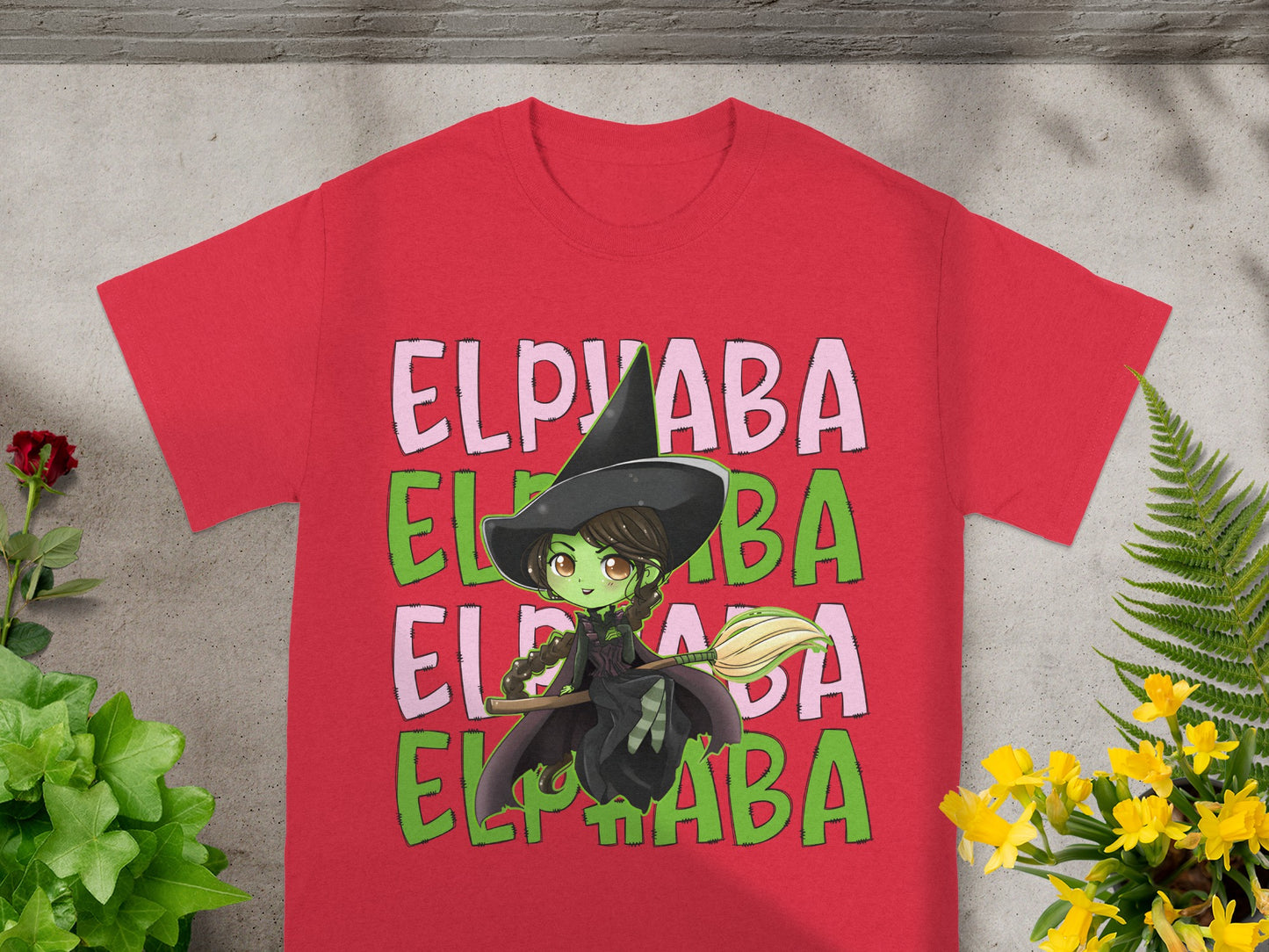 Red t-shirt with a cartoon witch and "ELPHABA" text.