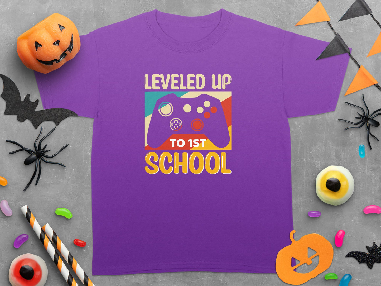 Purple t-shirt with "Leveled Up to 1st School" and game controller graphic.