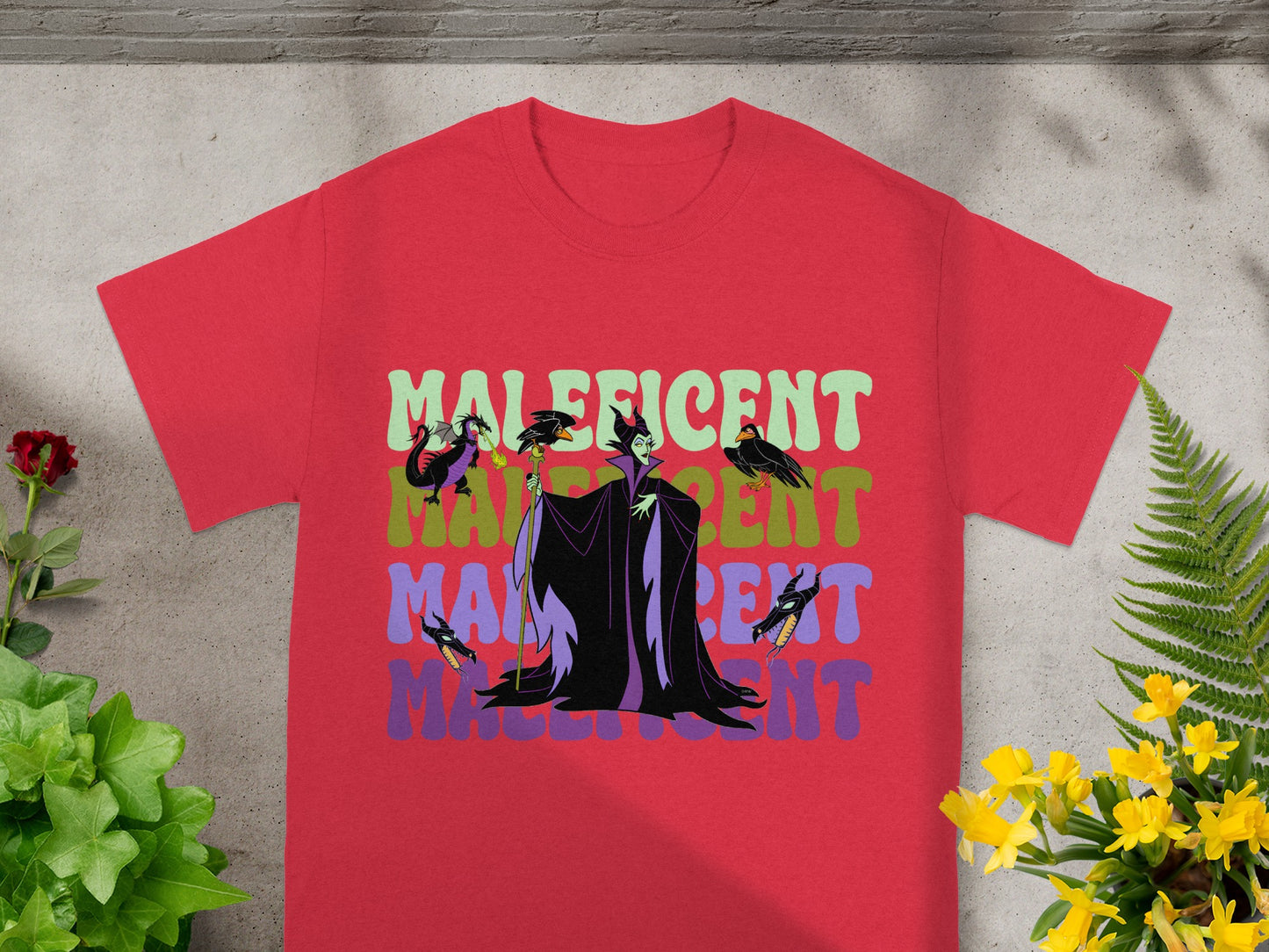 Red t-shirt with Maleficent and colorful text.