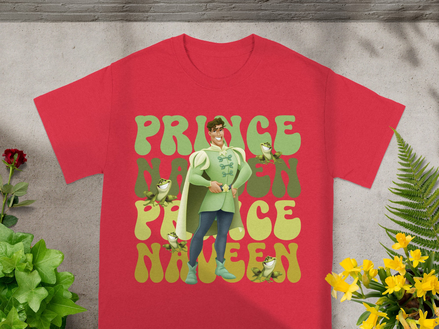 Red t-shirt with Prince Naveen graphic and floral accents.