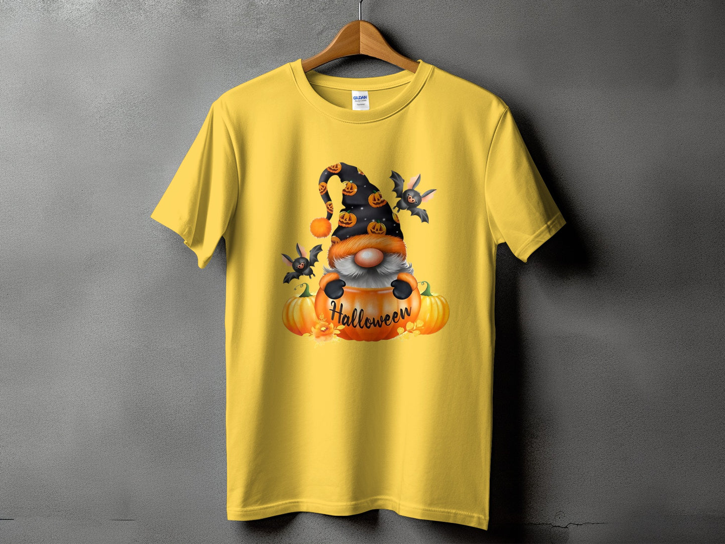 Yellow t-shirt with a Halloween gnome and pumpkins graphic.