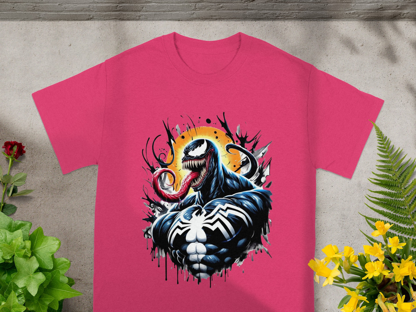 Pink t-shirt with Venom artwork, a comic book character with a long tongue.