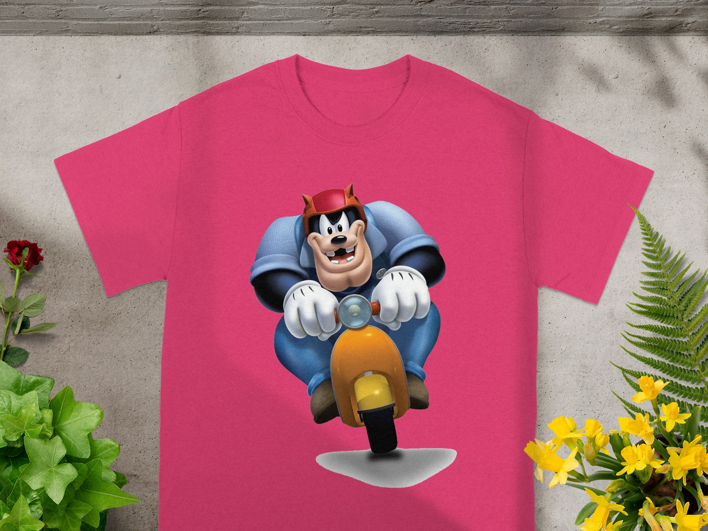 Pete the Cat riding a scooter on a pink t-shirt.