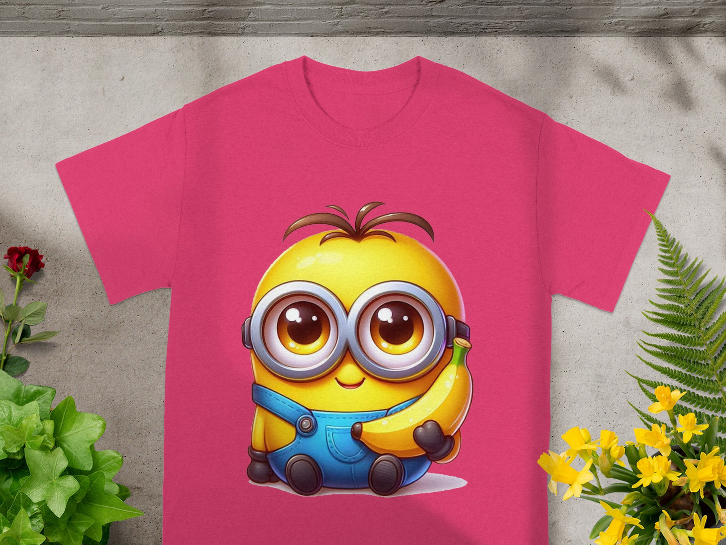 Pink t-shirt with a cartoon Minion holding a banana.