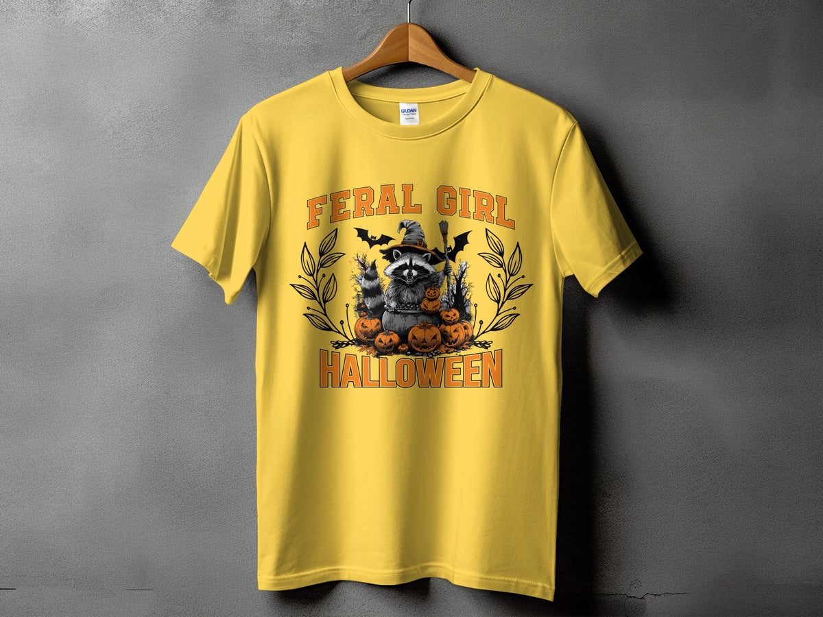 Yellow t-shirt with "FERAL GIRL HALLOWEEN" text and raccoon Halloween graphic.