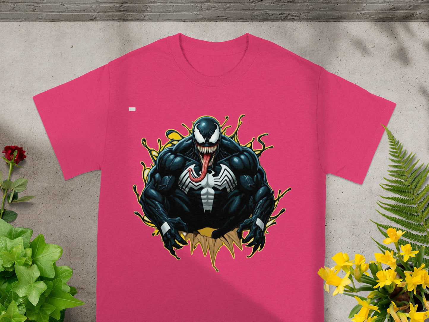 Pink t-shirt with a Venom comic art graphic.