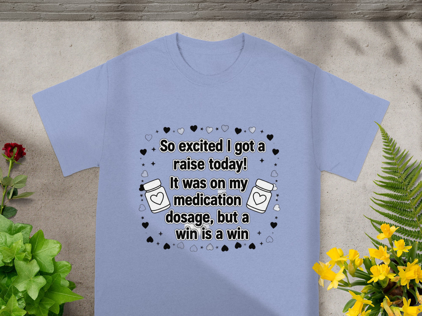 Light blue t-shirt with "So excited I got a raise today!" text design.