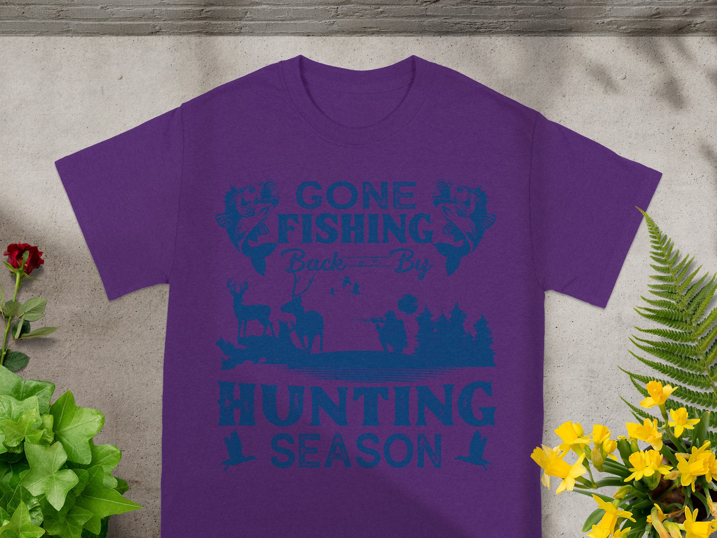 Purple t-shirt with blue graphic of "Gone Fishing Back By Hunting Season" design.