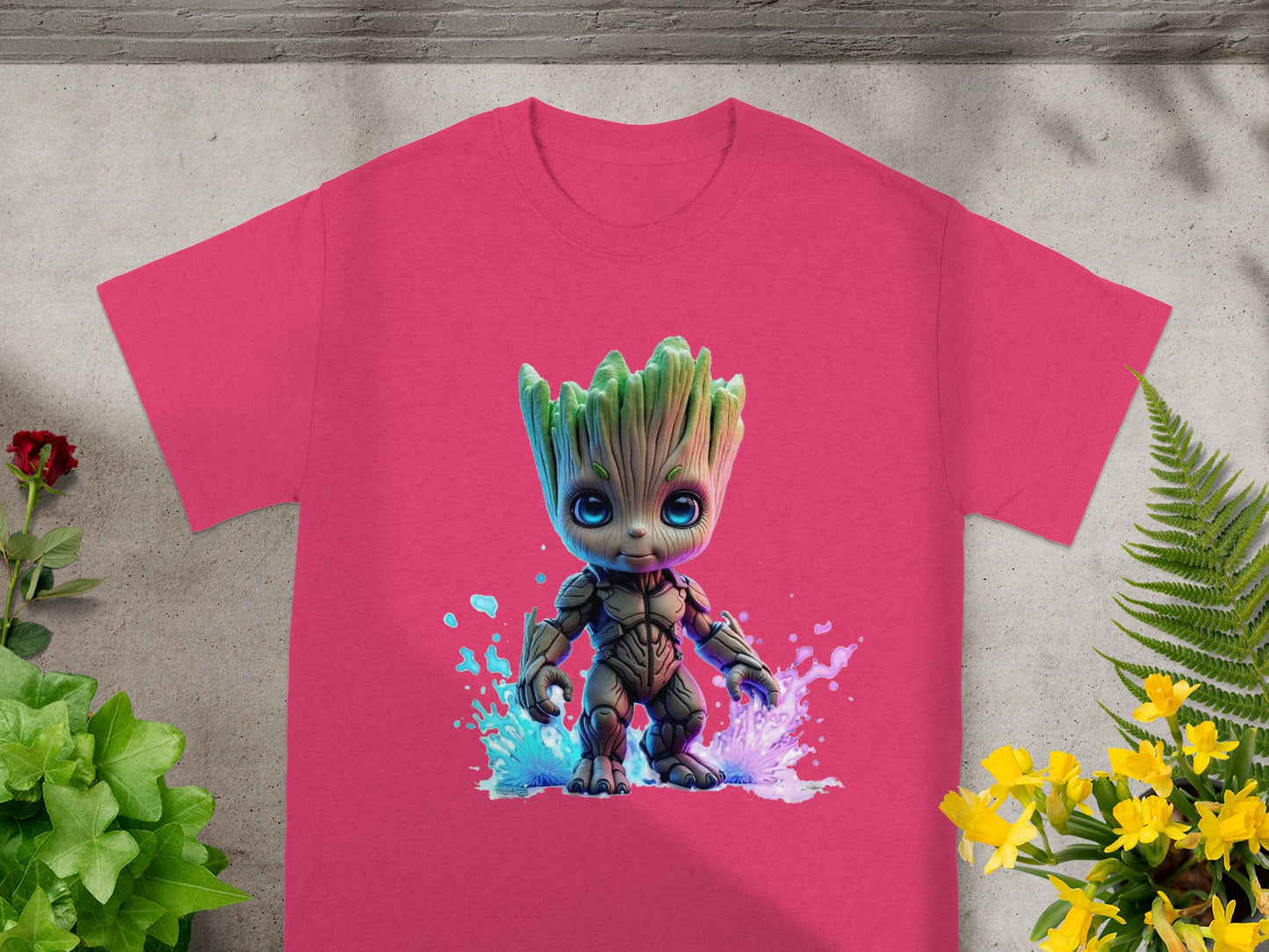 Chibi Groot character on a pink t-shirt with colorful splashes.