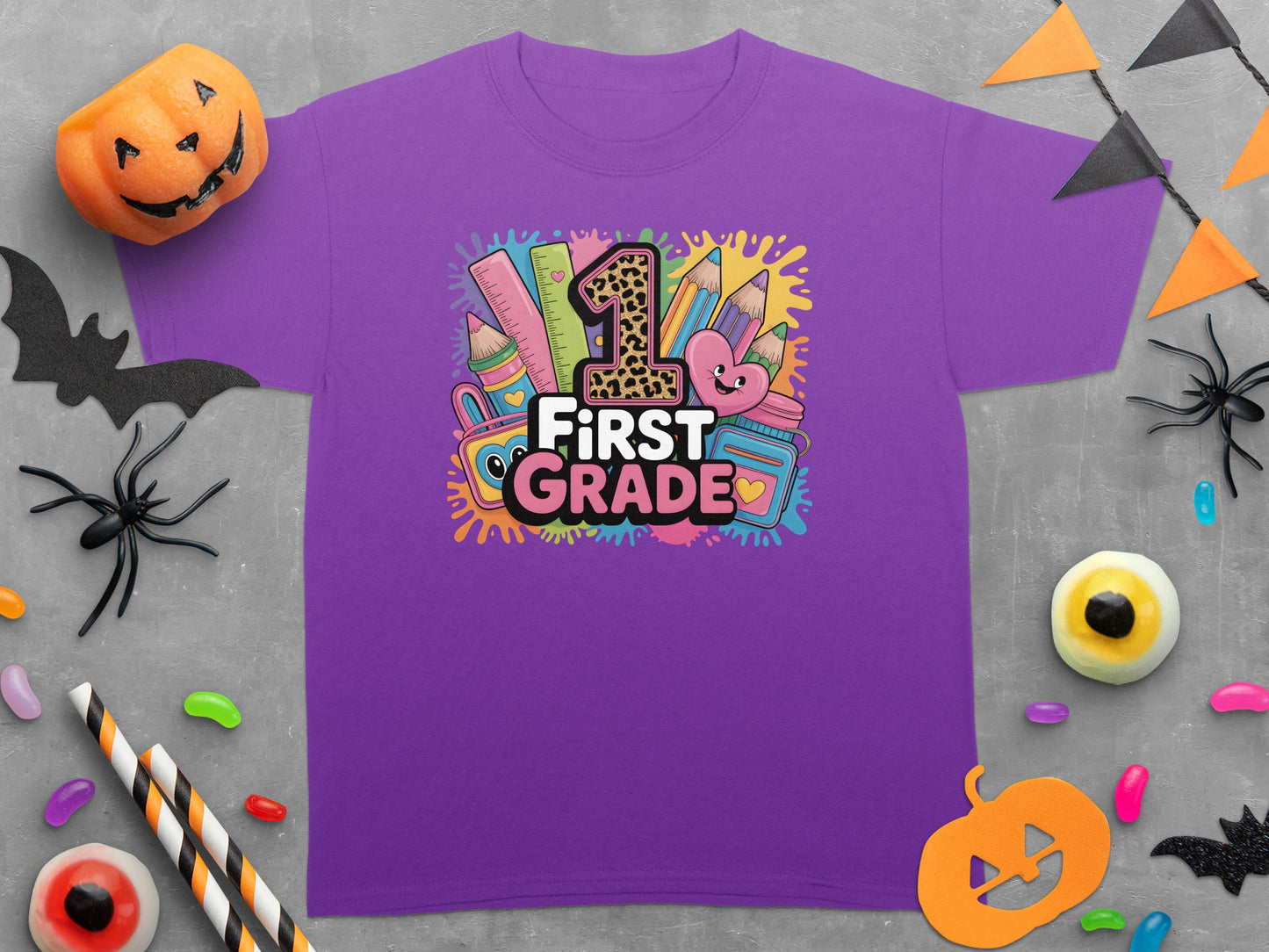 Purple t-shirt with "First Grade" design featuring school supplies and a number 1.