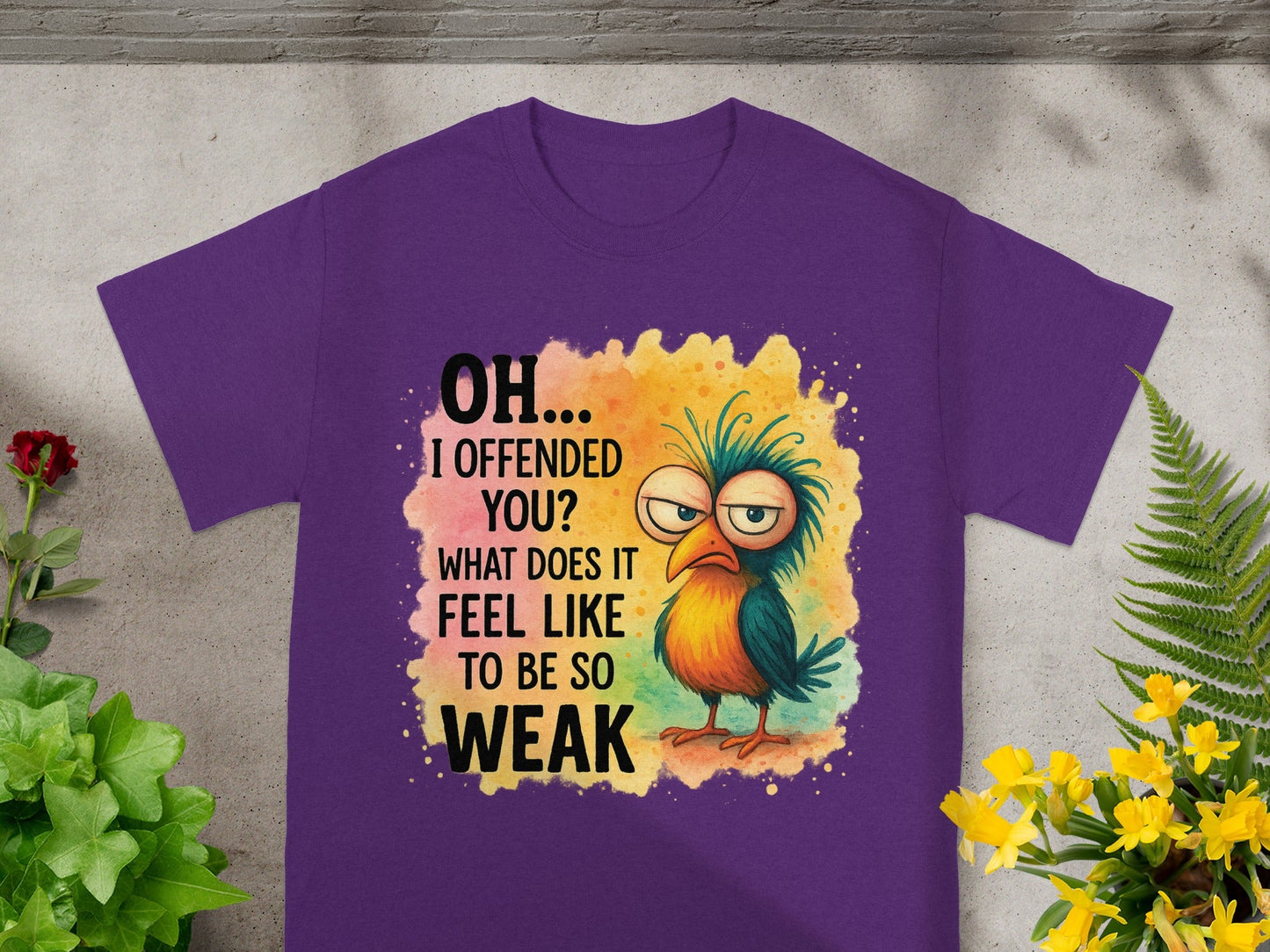 Purple t-shirt with cartoon bird and text "OH... I OFFENDED YOU? WHAT DOES IT FEEL LIKE TO BE SO WEAK".