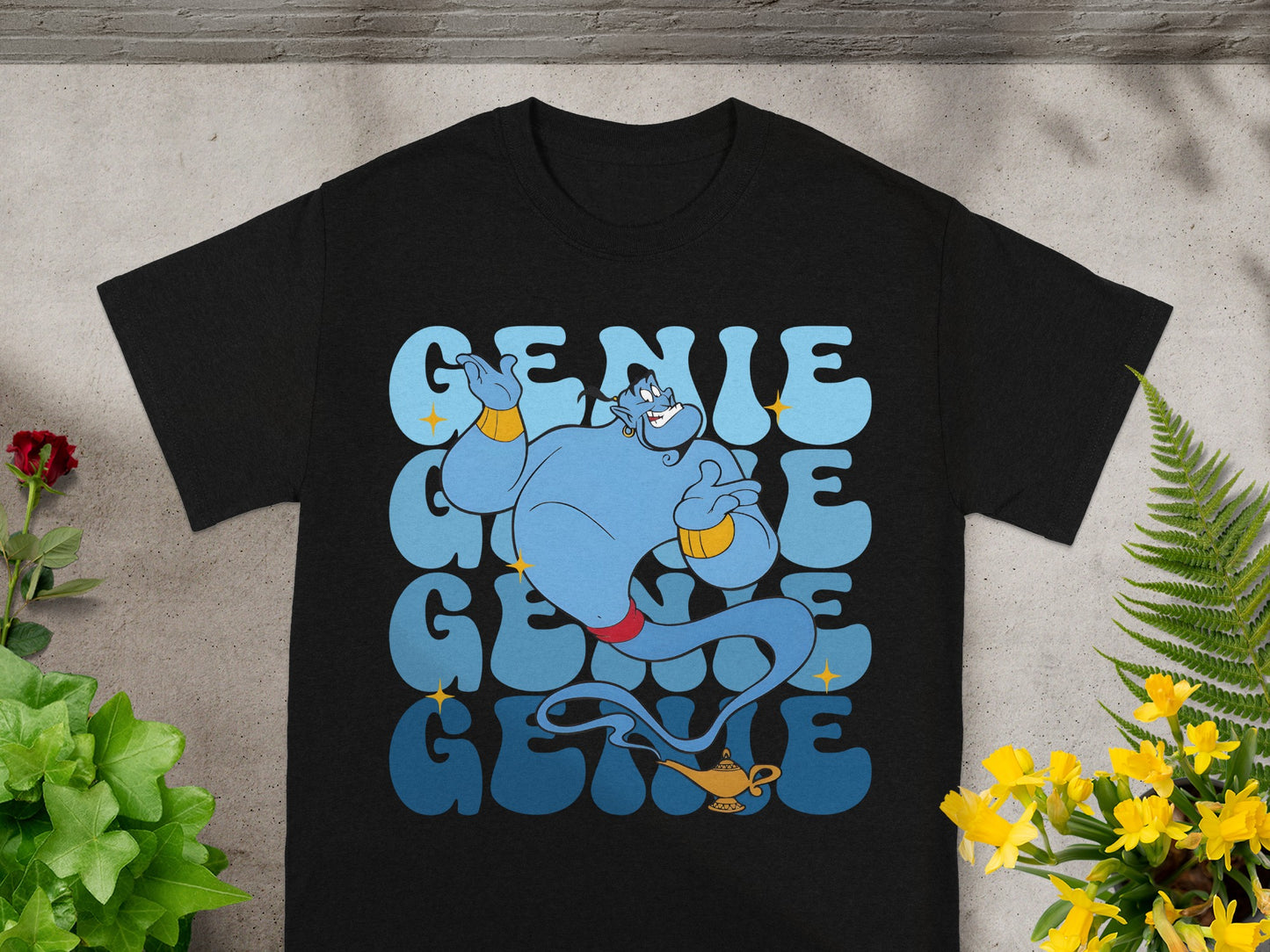 Black t-shirt with blue genie and "GENIE" text in stacked lettering.