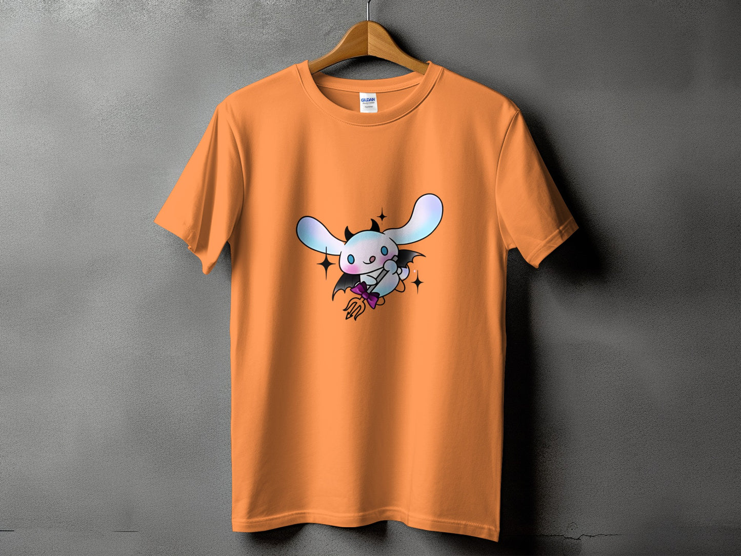 Orange t-shirt with a white bunny character dressed as a devil.