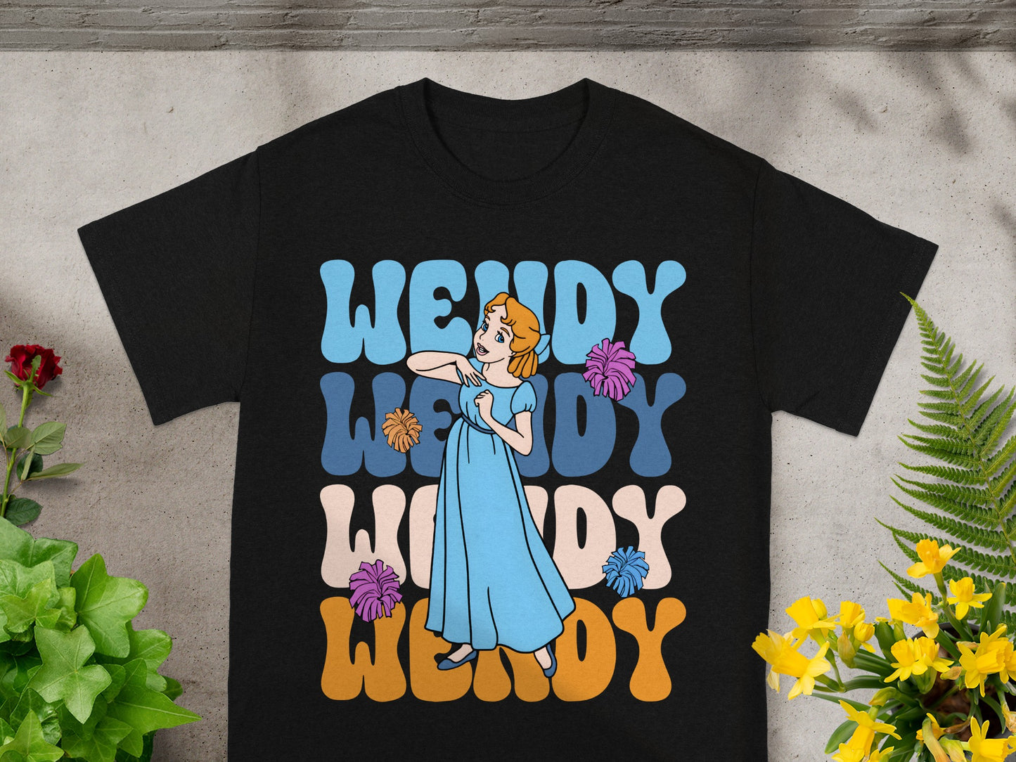 Black t-shirt with a stylized Wendy character and "Wendy" text in retro lettering.