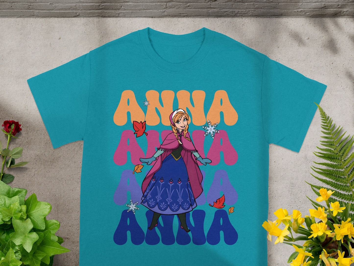 Teal t-shirt with Anna from Frozen character and "Anna" text.
