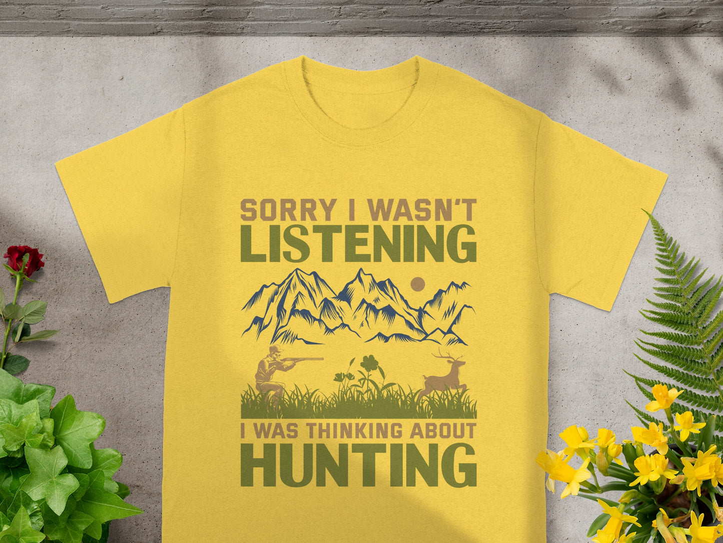 Yellow t-shirt with hunting graphic and text "Sorry I wasn't listening, I was thinking about hunting".