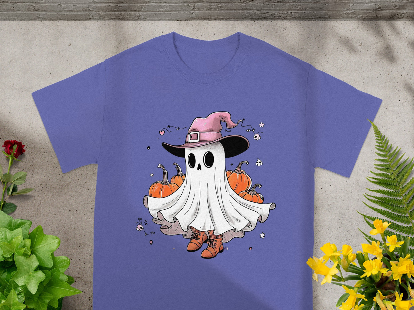 Ghost wearing a witch hat and boots, surrounded by pumpkins and Halloween decorations.