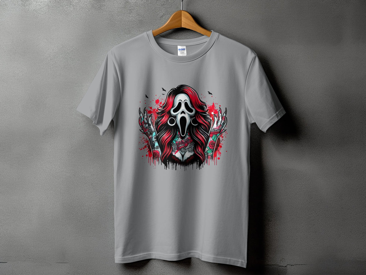 Grey t-shirt with a graphic of a screaming mask, red hair, and tattooed arms.