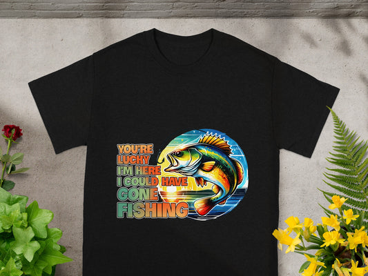Black t-shirt with multi-colored text and fish graphic: "You're lucky I'm here I could have gone fishing."