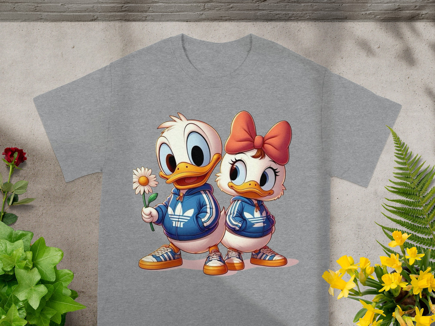 Cartoon Donald and Daisy Duck characters wearing matching tracksuits, holding a flower.