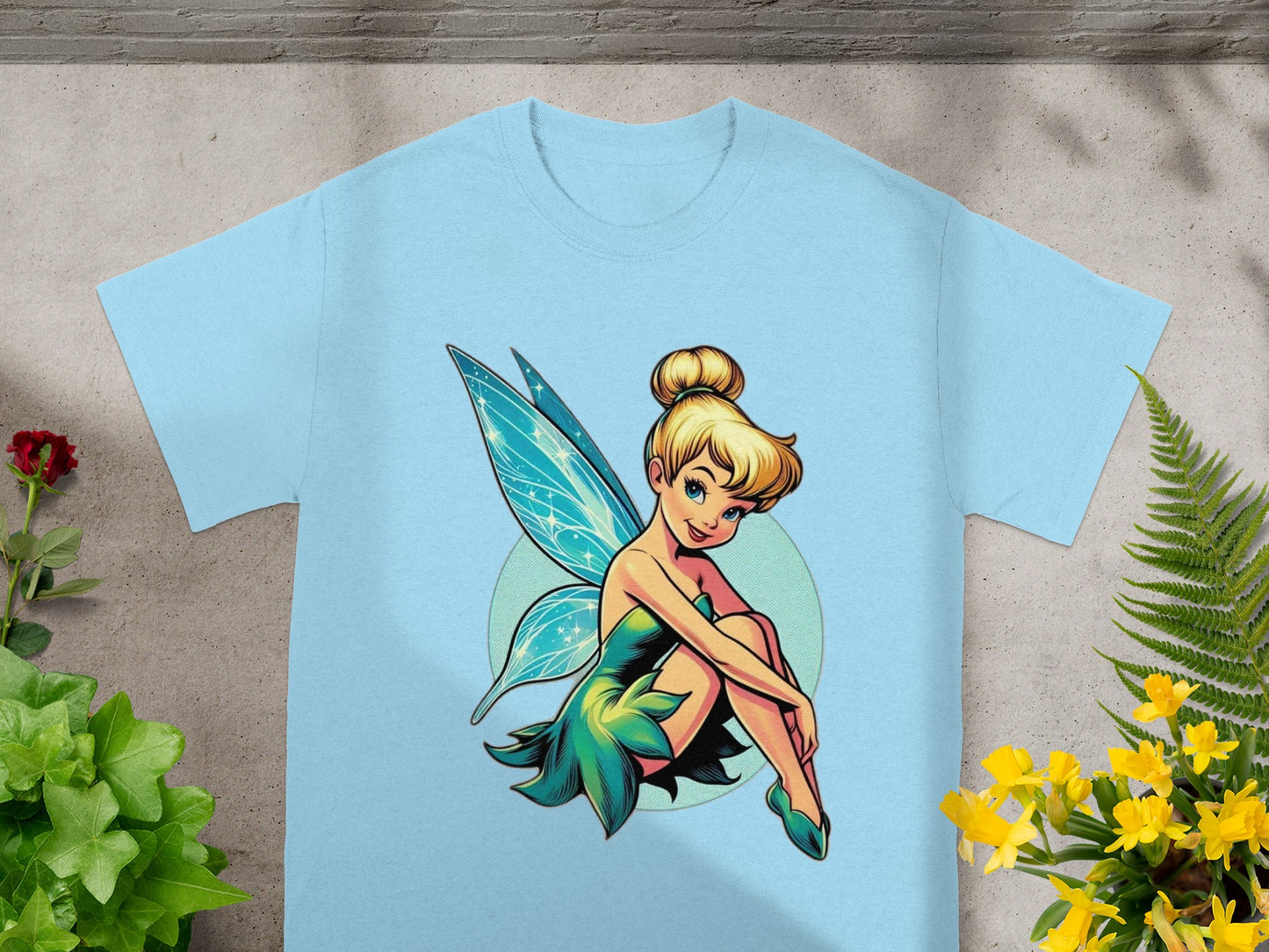 Light blue t-shirt featuring a cartoon illustration of Tinkerbell.