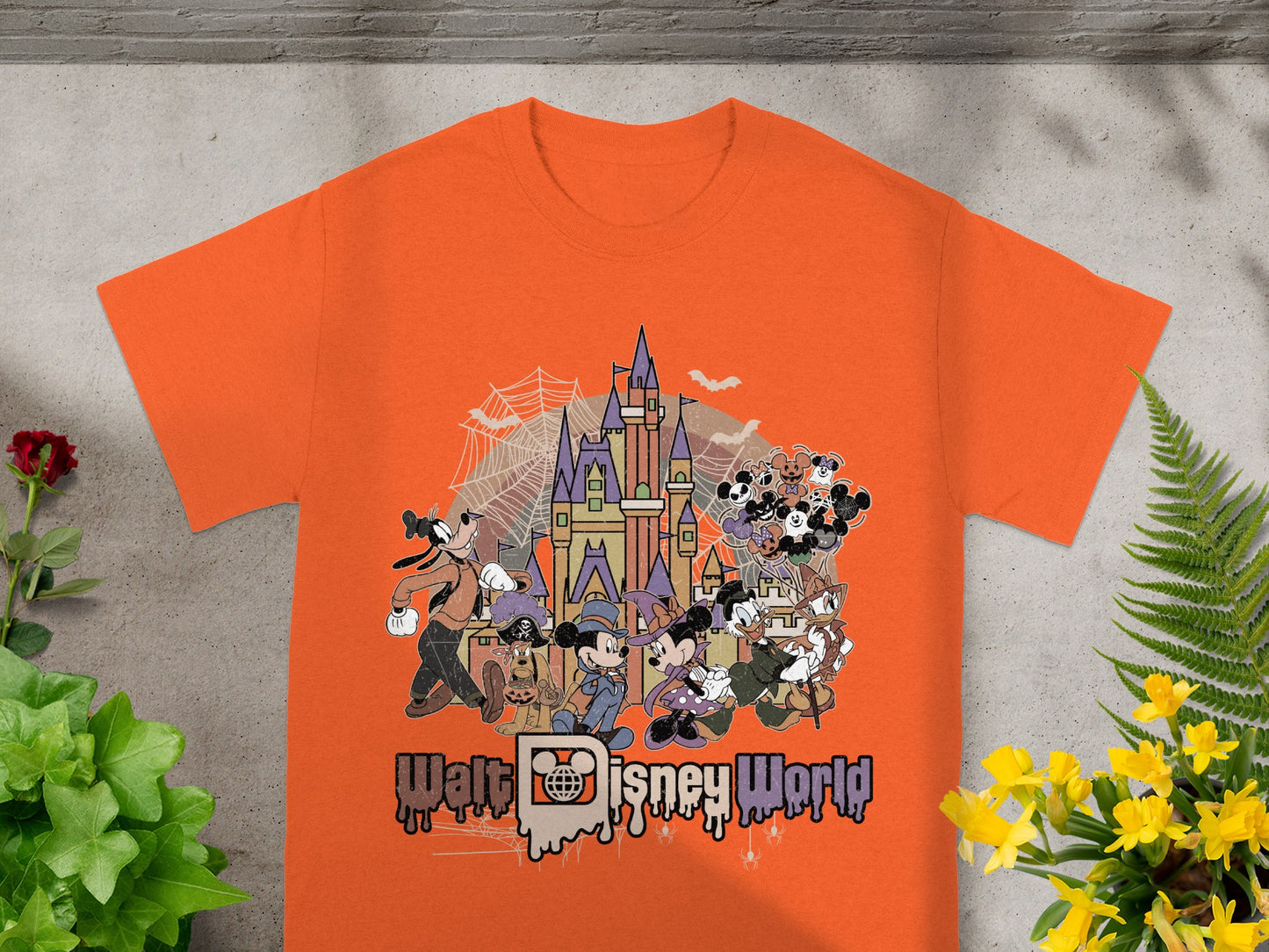 Orange t-shirt with Walt Disney World Halloween characters and castle graphic.
