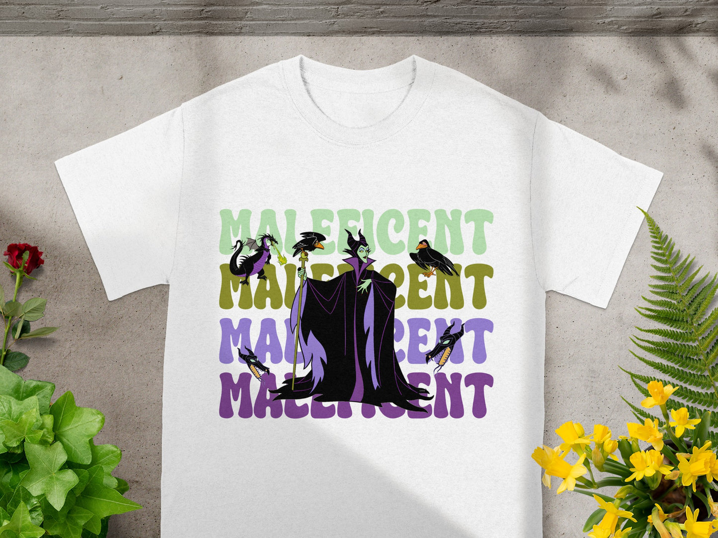 White t-shirt with Maleficent graphic and text.
