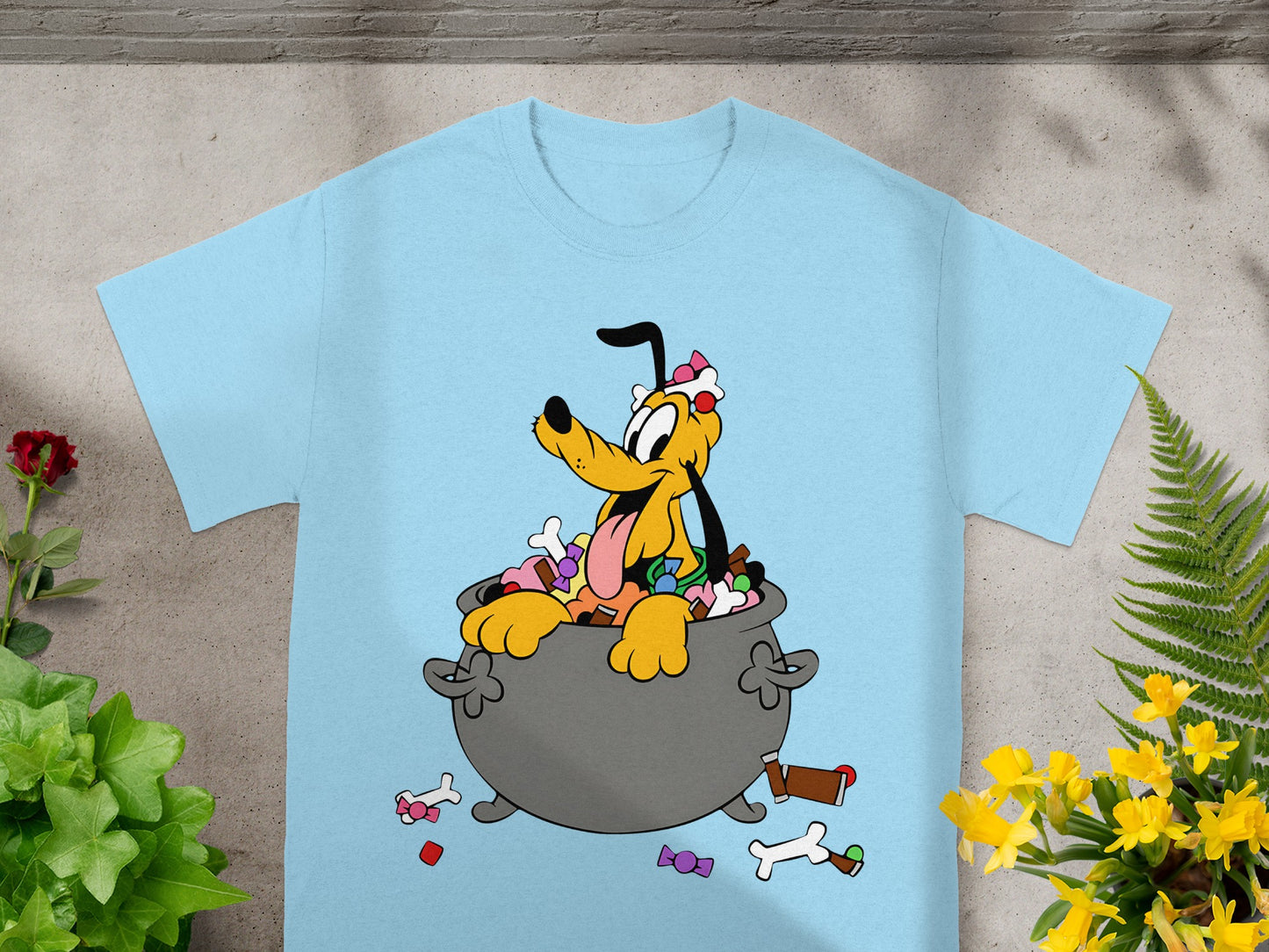 Light blue t-shirt with Pluto dog sitting in a cauldron full of candy.