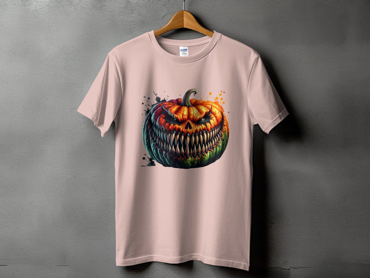 Pink t-shirt with a fierce, grinning jack-o'-lantern graphic and paint splatters.