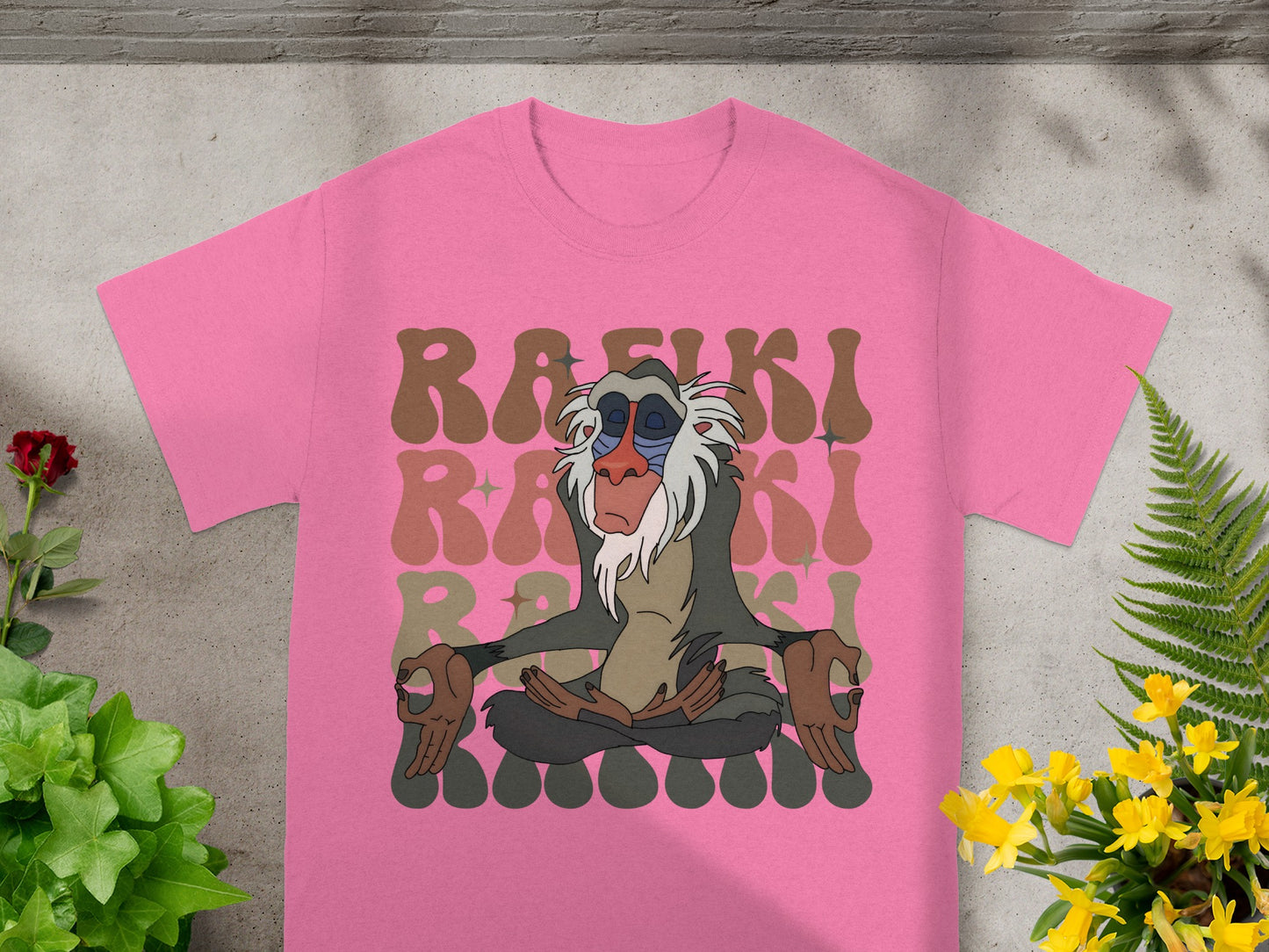 Rafiki from The Lion King meditating on a pink t-shirt.