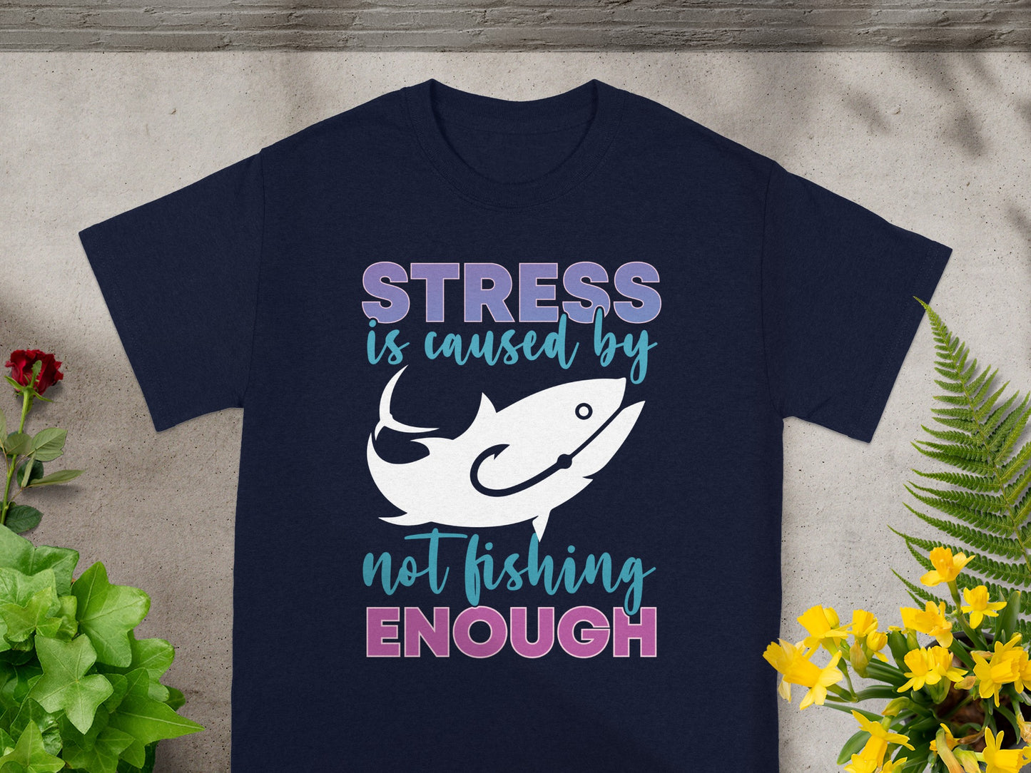 Navy t-shirt with text "STRESS is caused by not fishing ENOUGH" and a fish graphic.