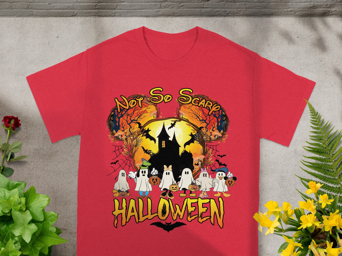 Red t-shirt with cartoon ghosts, haunted house, bats, and "Not So Scary Halloween" text.