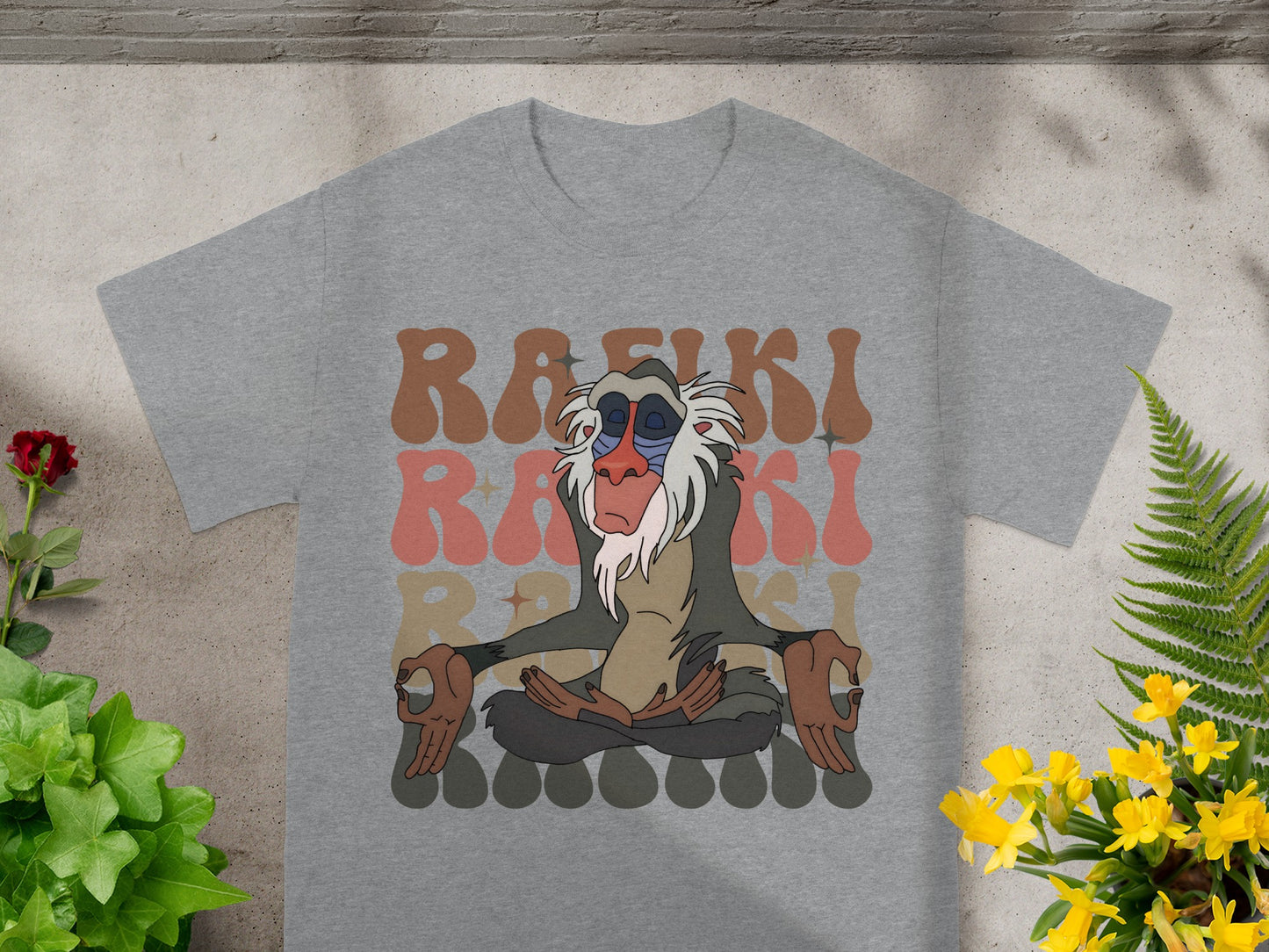 Rafiki meditating on a gray t-shirt.