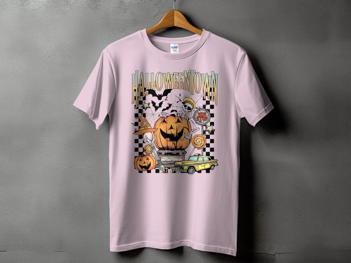 Pink t-shirt with Halloweentown graphic featuring jack-o'-lantern, skeleton, bats, and taxi.