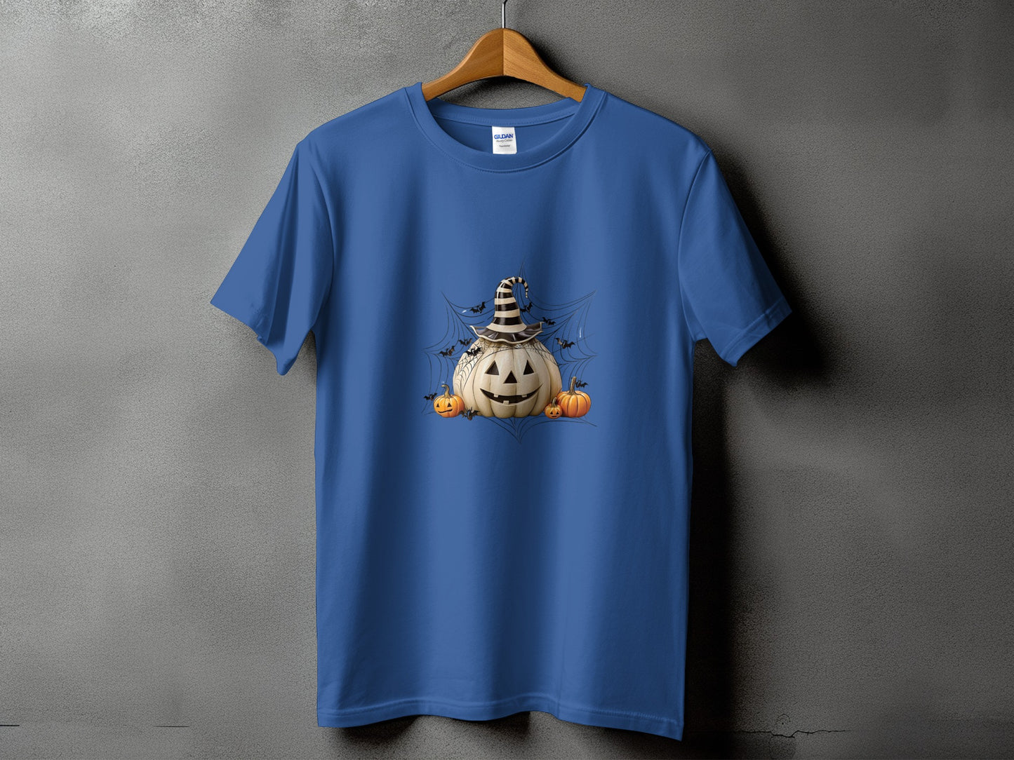 Blue t-shirt with a Halloween graphic of a pumpkin, bats, and smaller pumpkins.