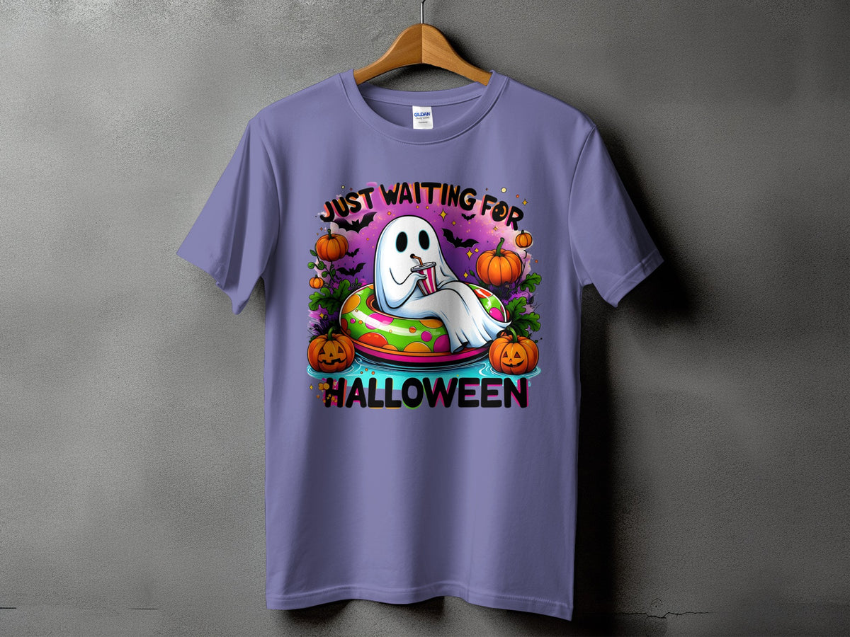 Ghost in inner tube with pumpkins and text "Just Waiting for Halloween."