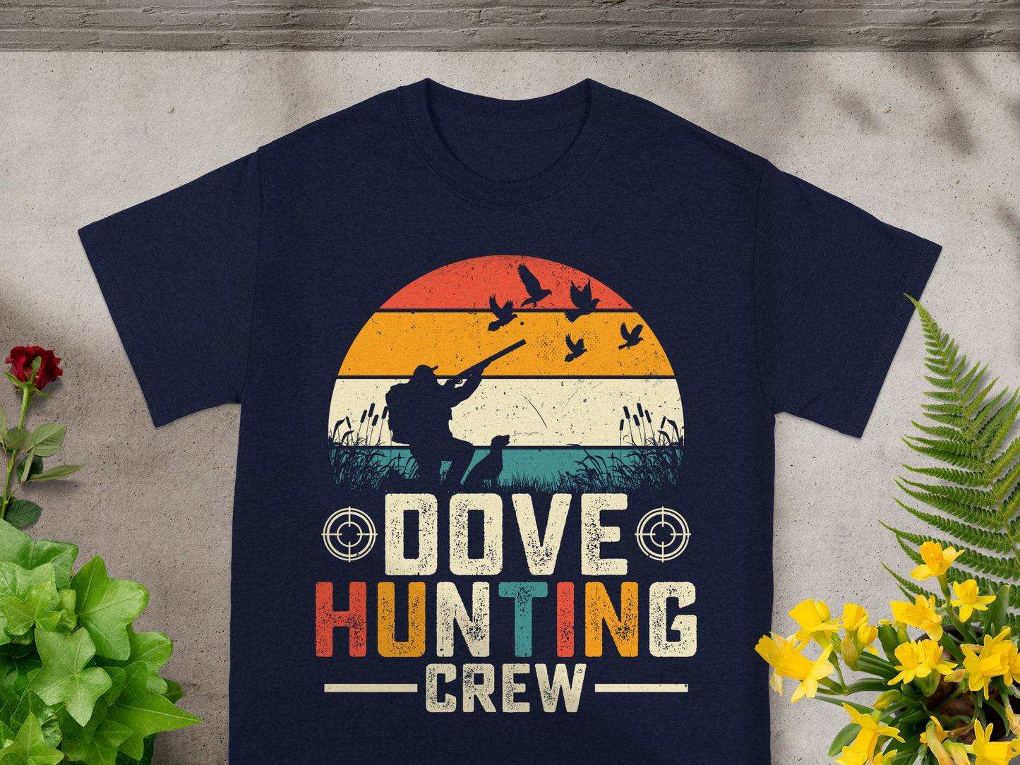 Crew text on dark t-shirt with dove hunting graphic and sunset scene.