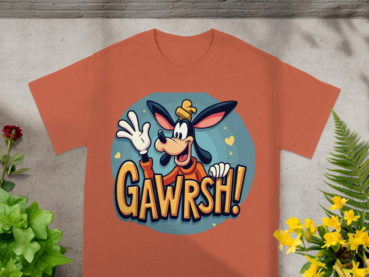 Goofy character with "GAWRSH!" text on orange t-shirt.