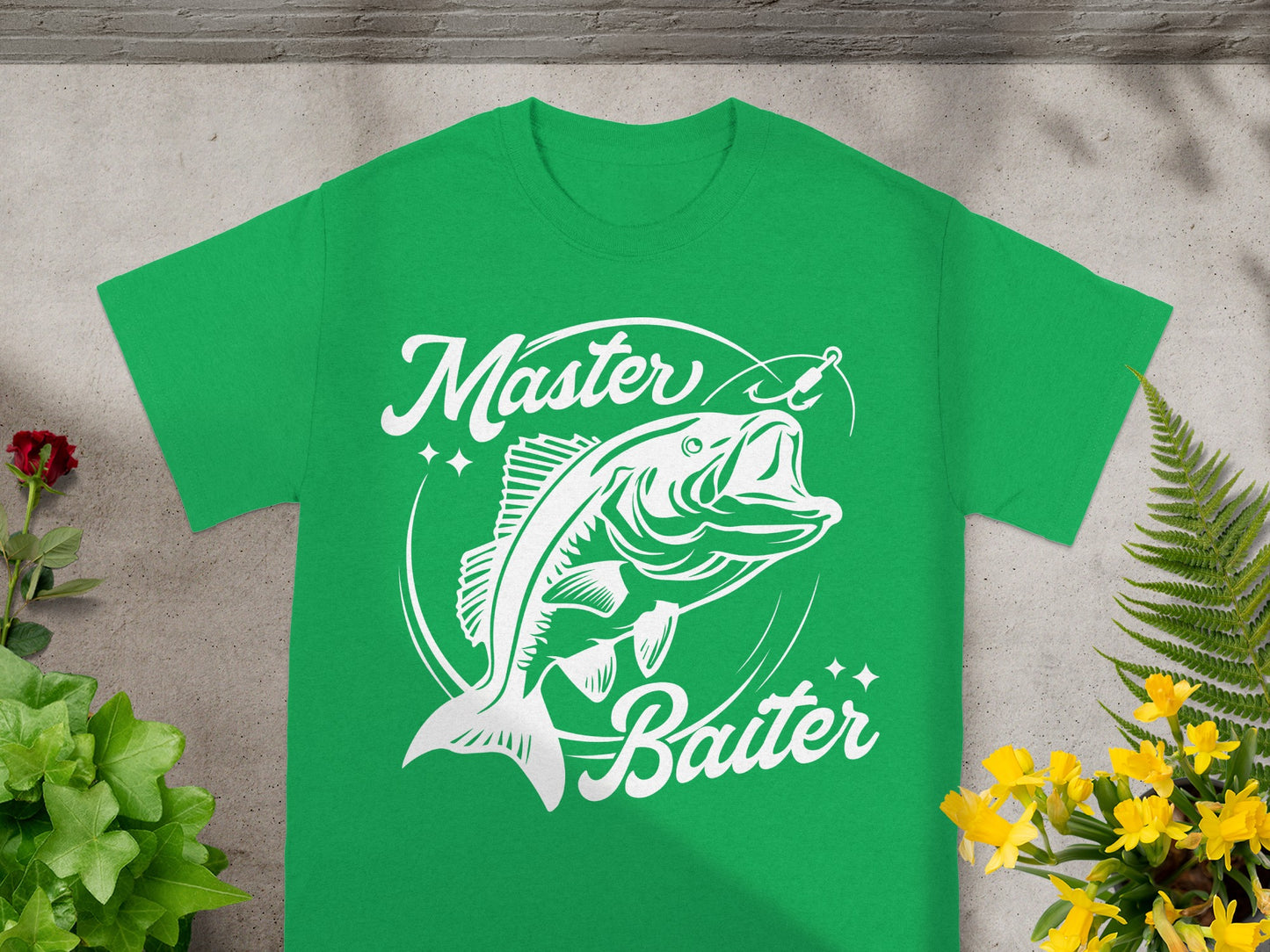Green t-shirt with white graphic of a jumping fish and text "Master Baiter".