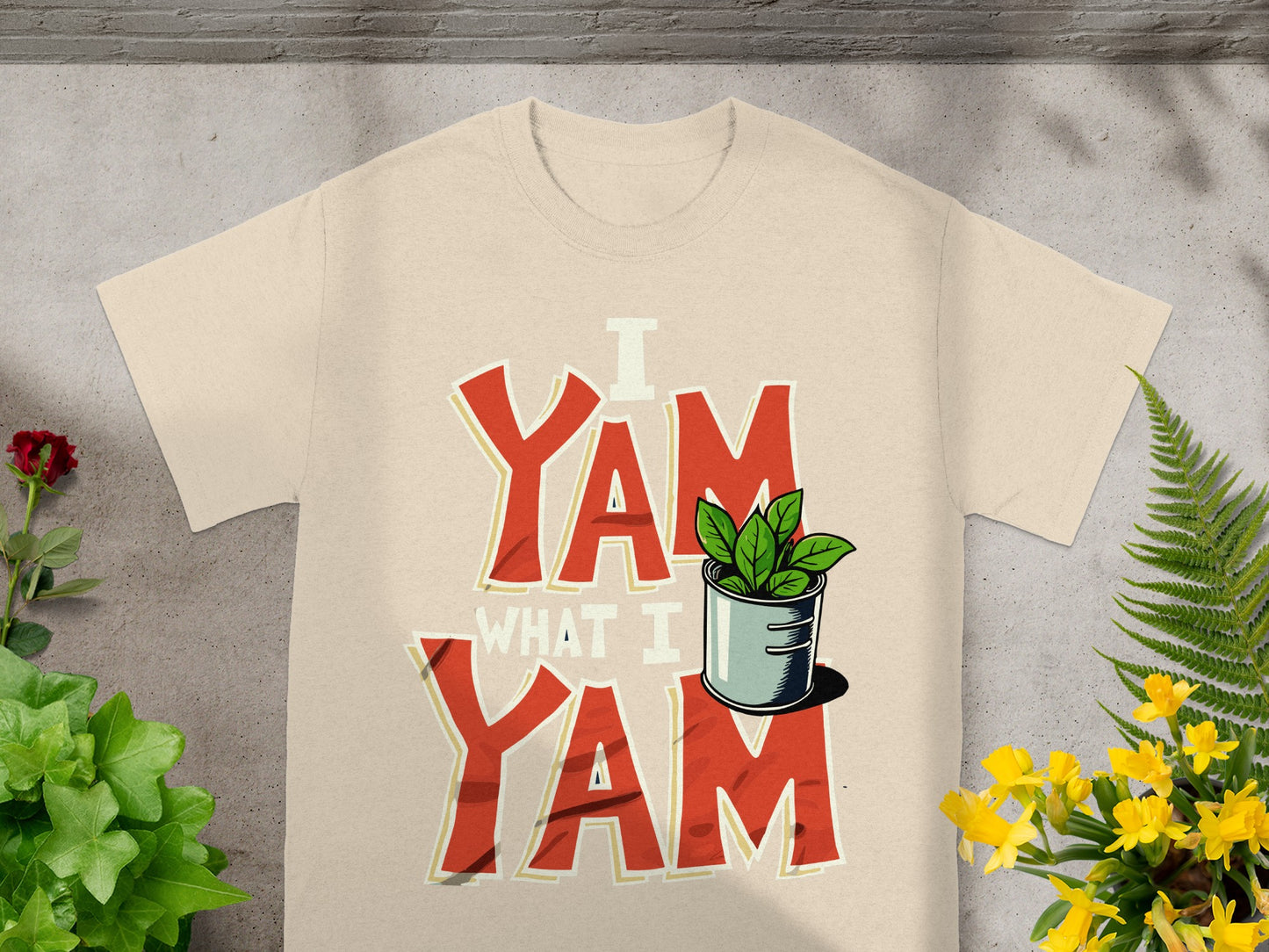 Cream t-shirt with "I YAM WHAT I YAM" text and a potted plant.