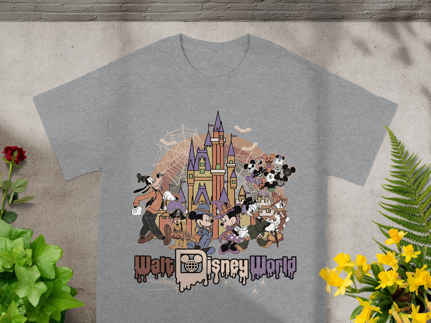 Disney characters in Halloween costumes gather before a castle with Walt Disney World text.