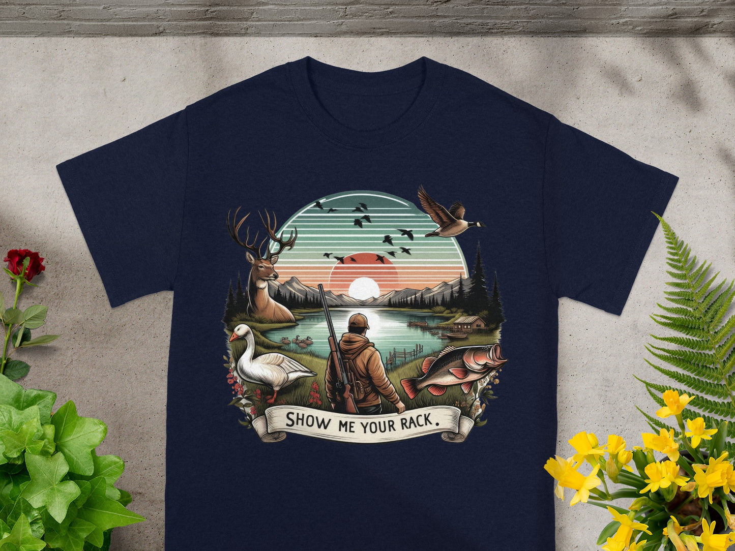 Hunter with rifle facing a lake, with deer, goose, fish, and text "Show Me Your Rack."