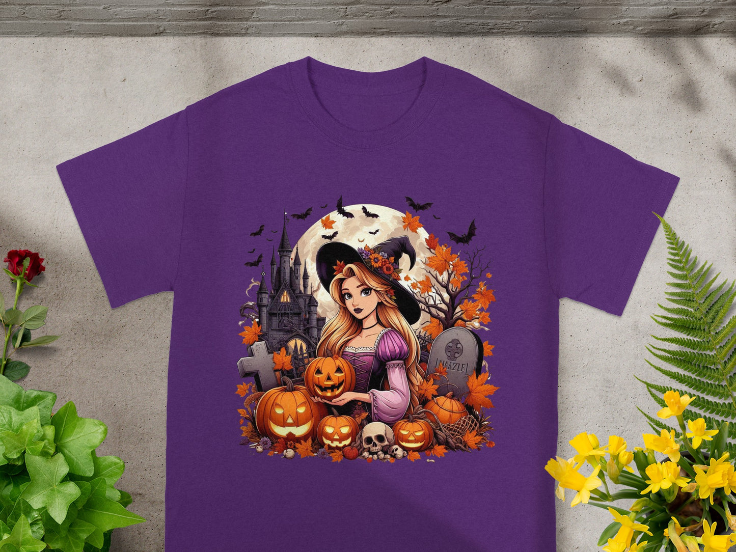 Witch with pumpkins and Halloween castle on purple t-shirt.