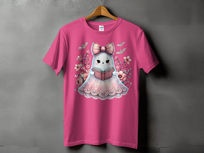 Pink t-shirt with a kawaii ghost reading a book surrounded by flowers and bats.