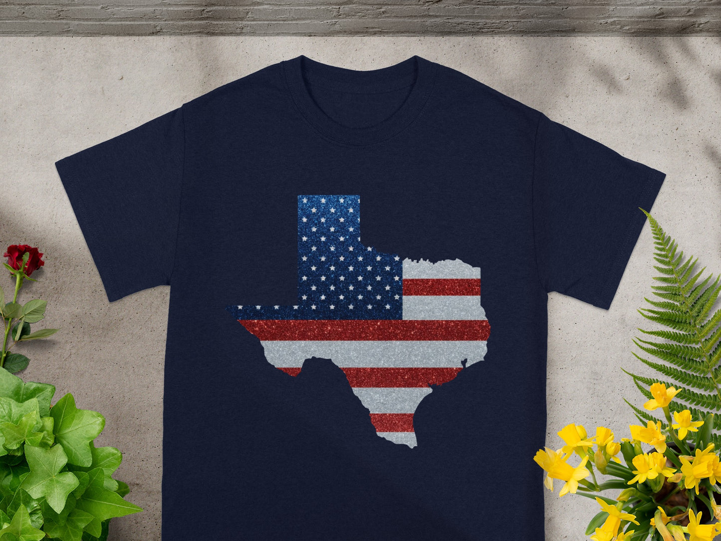 Navy t-shirt with Texas shape filled with American flag pattern.