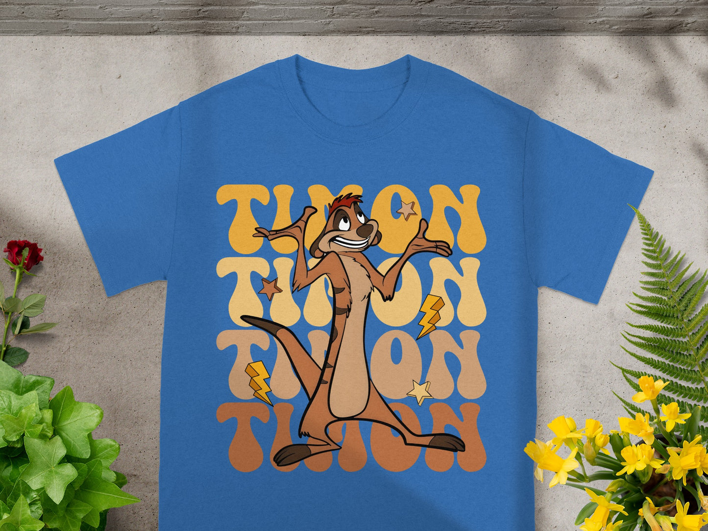 Blue t-shirt with "Timon" text and a cartoon meerkat graphic.